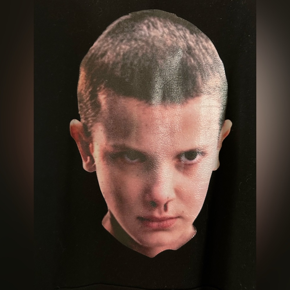 “Stranger Things” Roomy Hoodie featuring “Eleven” on the front.